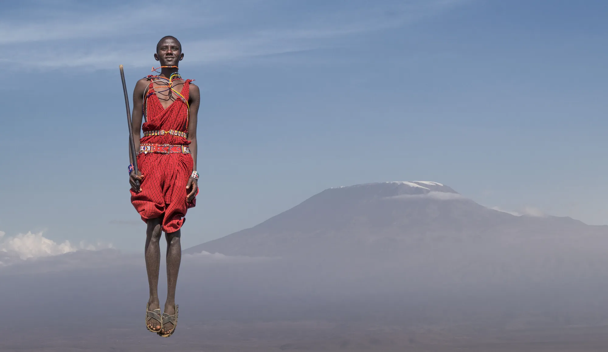 Maasai man in traditional dress near the Serengeti
