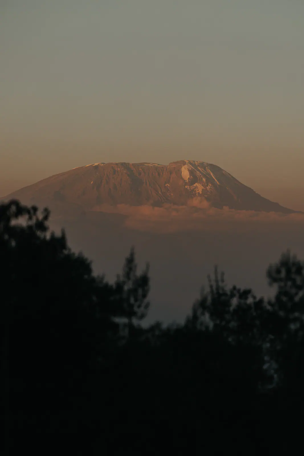 Kilimanjaro’s silhouette rising above the haze